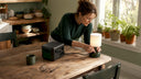 Woman connecting portable power station indoors