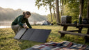 Woman setting up solar generator outdoors
