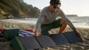 Man unfolding solar folding panel outdoors