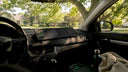 Solar trickle charger mounted on car dashboard